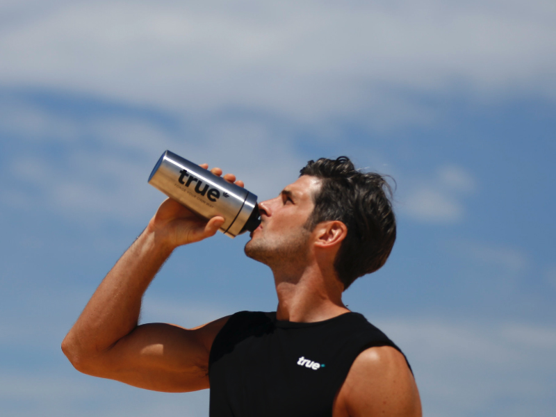 man drinking protein